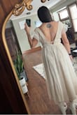 I bought this dress for my engagement photos. I absolutely LOVE it. It's super classy and chic. The length is perfect. Reached just above my ankles. For reference, I am 5'7" and 160 lbs. I usually wear a M/L. I was debating whether or not to get a L. So glad I went with a M. Its super comfortable. Keep in mind, you will have to use fabric tape to hold up the sleeves. It's also a bit see through, so do with that what you will. I could not recommend this more!! Definitely need this for your bridal look(s), Bach party, summer, honeymoon, anything!! It's so versatile! - Carolina O.