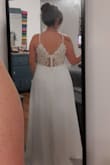 I am still looking at options but I love this dress. Keeping it for my wedding. It has weight to it and is great quality. The front is very simple but the back is just gorgeous. It is long, but I am only 5 feet 1 so that is to be expected. Beautiful if you are looking for a simple, elegant, comfortable wedding dress. - Kayla E.