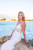 Fits true to size
Fits body shape & curves perfectly 
Very giving as you can tighten the back ropes as tight or loose as you wish
This dress does not need a bra
It is just as beautiful in person, as it shows in the pictures.
It was the PERFECT beach wedding dress I was looking for.
You can even hand wash out the bottom of the dress & line dry, if it's gets water and sand on it.
I HIGHLY RECOMMEND THIS DRESS !!! - Theresa W.