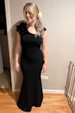 I wish it came in more colors! I ordered this dress for a formal wedding. Out of 5 dresses I ordered, it easily won. It's modest in that it doesn't show a ton of skin, but shows your curves. The ruffled shoulder kept me warm (wedding was in early March in Chicago). I felt so stylish! It did require a hem around 4cm while wearing 2inch heels and I could have take the left strap up a smidge. It's comfortable. You can wear a normal bra, but do invest in seamless panties. - Melissa S.