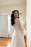 I was a tad apprehensive to order this since there were no photo reviews, but I'm so happy I did! I wore this for my courthouse wedding and it had the perfect flow to it! I ordered a small and felt as if I could have sized down, the only reason why I didn't was because I didn't want to wait for shipping on it! If you're in between sizes and have a smaller bust, I'd size down so it hugs your chest properly. - Isabel M.
