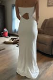 I love the material and the fit of this dress but I ended up going with another dress that had straps. It's stretchy and shows your curves you didn't know you had. Prettier in person I think. - Delanie S.