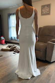 This dress is stretchy and is a nice thick material. It's really a great value and this is the dress I'm choosing for our wedding. I think I'm going to alter the back to be a V shape and add a little lace at the waist and maybe trim the back with lace too. It's such a good price I can alter it the way I want it and I've still spent wayyy less money than most people on a dress I'm only wearing once. - Delanie S.