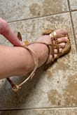 Beautiful shoes, but the wrap around strap with the buckle is too long. I got a 8.5 in green and a 9 in the gold and both straps are too long to fit around my ankles, plus theres a big gap on the lower section that connects to the wrap around strap. There's over an inch of a gap even on the tightest buckle. I would have to puncture my own hole but even then I would have to cut off one of the leaves to do it. Maybe someone else could make them work, unfortunately I could not. Still beautiful though! - Holly K.