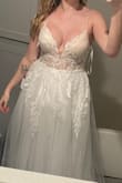 This is truly a stunning dress. I immediately fell in love with it. The top however isn't the comfiest. The straps are made out of a stiff tulle and with the weight of the dress they are digging into my shoulders. Also, the dress rubs under my arm in the back towards my shoulder blade. I think if I had smaller breasts this wouldn't be an issue. They're not really a lot of room for the girls in this dress. Debating keeping it but I would definitely need alterations in the top. - Jasmine H.