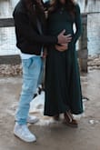 I used this dress for my maternity pictures and it was great! The green is so beautiful and the material is so soft, it also has some stretch & flow at the bottom which is always a plus! I ordered a medium and am currently 158 lbs and thought the fit was just right! - Abby T.