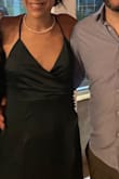 Unlike the other 2 dresses that I ordered in M that were too big, this one fit perfectly. It's a siluetee so order what you think is best for your hip area (not a flowy, stretchy form). I wore it at our informal marriage party in Argentina and loved it - comfy, fancy, nice colour and shine, classy. One sadness is that 3 of the buttons fell out. I was having a good time but I would have expected better quality sowing so that this nice detail would have withstood the night. Sadly, lulus wasn't able to send me new replacement buttons which is the only way to save the dress as they are made in the same textile of the dress so hard to replace. So if you get this dress, be careful - it's more gentle than it seems! - Vera B.