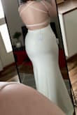 The dress fits like a glove! The material is stretchy and comfortable. The straps were not adjustable like i thought, didn't bother me that. - Isabella F.