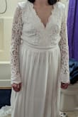 The dress was pretty but I think I should've ordered a small instead of a medium. The part that went towards my back was loose. The top in general was a little loose. - Sarah K.
