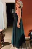I bought this dress to wear it to a wedding. It fits true to size (I bought extra large size) though I had to have it hemmed. The fabric and flowing design fit nicely and I did not need to wear a girdle. It's very elegant, I got so many compliments! I wore it with silver platform 12-inch sandals and brought an off white cover up with me just in case it was chilly.  It was a late summer wedding but the color is perfect to wear any season. So happy with my purchase! - Patricia C.