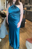 Felt like everything was off with this one. I spent about 10 mins fiddling with the chest section & my chest still looks wonky in it. It felt like there was somehow not enough room in the bottom part of the chest but too much room in the top? Hard to explain but I really struggled! It also had an odd piece on the back of the dress that poked out and wouldn't lay flat no matter how high or low I pulled the dress. Very odd; not sure what that was intended for. I also wish it had a slit. The neckline was cute though and the color was beautiful! - Emily H.