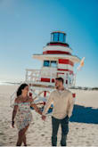 Loved this dress for our photos! No issues with it staying in place. The wind caught it weird in some pictures, but I think that was more of an issue with when the photo was snapped than the dress. Very fun and flowy! - Danielle D.