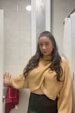 Cute sweater but be careful of nip slips if you have larger chest. The top is pretty short and opens easily. - Marlene R.