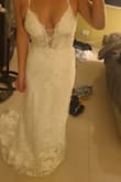 This dress is gorgeous!! I was so close to buying a dress I found in the store for $1k, but something told me to look on Lulus first. I randomly stumbled across this dress and for $300 (with the email sign-up discount) it's a steal! The quality is beautiful and it is the EXACT SAME DRESS I was going to pay $1,000 for in a shop. Fits true to size and is a little adjustable due to the strappy back. It does fit pretty long (I'm 5'5.5) so I'm probably going to hem it for my beach wedding, and I am usually an 8/10 in street sizes, and a size 10 fit like a glove!!! The ivory is still pretty true white, but not a bright white (if that makes sense), probably considered a very light light ivory or off-white. It was risky buying online, especially since there was only one review, but totally worth it. Buy this dress! - Liel C.