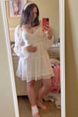 This is my second time ordering from Lulus. After looking at the reviews, I was sure that I wanted to go with this dress for my bridal shower! The shipment came two days early, which I was excited about. I ordered a MEDIUM! When I tried it on, the sleeves were a little long, but the dress was NOT too short (which is what I was worried about). The waist is stretchy, and the strings in the back can tighten or loosen the dress. I tied mine tighter. It fit fine, but I did exchange it for a small one because the sleeves kept slipping off my shoulders. The cups were also slightly large. Pro tip: pull the dress down more so that the cups are snug against the breasts. It looks & feels better.

I think the small will fit my body a bit better! I got so many compliments when I sent it to my friends!

(Headband is from Amazon).

- Madison, MN - Madison F.