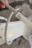 The tulle bows are super cute and felt very bridal but the straps were very bulky and like others said, very tight on the ankles. There were also stains on the straps so check carefully. I returned this one cos I chose another lulus shoes. - Htet Y.