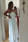 I have looked at sooooo many wedding dresses, and this one is EXACTLY what I was looking for! According to the size chart, I am a size 10 but ordered a size 8 since my size wasn't available. Even with that, the size 8 is a perfect fit for my figure and bust. Need to lose about an inch to fit into the dress, and is a motivation factor for me because I LOVE this dress! The dress is a bit long, but a walk down the aisle won't be a problem with the cut down the middle. 

LOVE THIS DRESS SO MUCH! - Kahealani A.