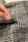 The jacket is attractive overall and pairs well with business casual clothing, but the stitching of the jacket is terrible. On the very first wear, within 2 hours, the stitching on both pockets had come undone at the corners. Only my phone was placed in the pocket, so this was not a matter of overstuffing or aggressive wear. There is also visible pink ink (?) on the exterior fabric near the pockets from what I assume must be original markings for cutting/sewing. The shoulders are also a bit tight if you lean forward with both arms to reach for something, as the interior (cheap) fabric does not stretch at all. - Emily M.