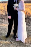 I absolutely love this dress! I bought it last minute with no time for alterations. So happy that it fit perfectly! I bought a rhinestone clip for the train. I forgot to remove it before the pictures :( I got a lot of compliments. It was an amazing day! - Holly G.