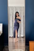 This dress is unique, yet has a brush of timelessness to it. I got the LAST magenta one in my size and I'm so glad I did. The magenta gives off a more flirty, fun vibe, whereas the navy looks more elegant. 

The only reason it doesn't get 5 stars is that the slit goes up VERY high, so you'll need to be conscious about that while sitting or dancing. You will also need to reinforce the sewing on the little clasps at the top of the zipper. - Danielle L.