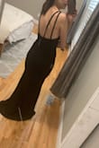 I bought it as a bridesmaid's dress and with hopes I could wear it again in the future. I decided on this one based on the reviews and they were spot on. It's a beautiful silhouette with a nice back. It is long but I expected it. It's only fair for people that are taller. - Danielle F.