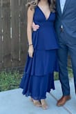 Fit really well, had to shorten the straps since my torso is short and I didn't want to flash anyone (you can't wear a bra with the dress). Overall felt like good quality fabric and is very flattering. - Laura F.