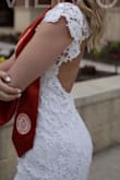 I got this as one of my dresses for my graduation pictures! It fits snugly but as expected. I really loved the back for pictures. - Skylar K.