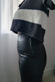 I have a petite body frame. However, I am a bit on the curvier side. I'm 35 years young and I'm in fairly good shape, these pants accented all the things I don't like. It's created a pooch, but I have a relatively flat stomach. My butt was cut in half. I have a nice butt and it's definitely not completely flat. These pants are tight and flatten my butt like a pancake. But the rest of the pants were loose throughout the thigh. The model in the pic is thin and slender.  It looks wonderful on that body type. I'm not sure these pants are petite curvy friendly. If I sized up I'm sure that my butt would fit a lot better but the rest would be ill fitting. - Diana C.
