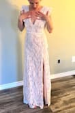 First of all the dress arrived in like 3 days. I am super impressed with the quality of materials the dress is beautiful. I love it. I just need to add some padding in the chest for my lack of breasts. These are try on photos only the wedding is in 6 months:) - Tierney F.