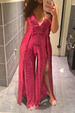 Incredibly flattering and well-made jumpsuit. I went down a size to XS because I have a smaller bust and the style is wide-leg. I wore this out dancing and had to tighten the shoulder straps a couple of times since the weight of the garment pulls on them- but no big deal. I wore 3.5 inch heels and the length was perfect. This is a showstopper, so brace yourself for allllll the compliments! - Vanessa K.