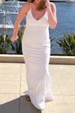 I wore this dress to be married by court. It arrived in a timely matter and I initially purchased it with the thought I may find something different, is it too simple, do I look horrible, etc. but I put it on and loved it. The back zipper needs assistance from a friend or your hubby. I have added a few photos. I did wear a shaper, no bra. - Kelsey C.