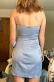 This dress is really flattering! The slit where it wraps over is a little dangerously short on me but I just pull it to the side and the dress is a little longer in the back which makes it feel classier. The material definitely wrinkles but I'm going to wear it still for a summer wedding. - Alyssa