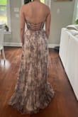 the corset top is to die for. the back is a beautiful cross tie. the corset too is also padded. the pleated bottom is very nice and it's a high quality dress - Carlie F.
