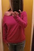 The material is thinner than I thought but it is comfortable.  I got it during a sale and am not sure I would pay full price for it but it is a good spring to summary sweatshirt substitute.  I like the long sleeves and it can be worn on or off the shoulder. - Lorie J.