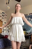 As a tall person who is a bit smaller chested I struggle with online shopping for clothes, especially dresses. This was one of two white dress I ordered from Lulus and when i ordered it I had hoped that it was going to feel really nice and look good on me. I have never really been one for dresses as my body was a huge insecurity for me growing up but since I got engaged 6 months ago I have been determined to get myself some really cute bridal outfits. This one I ordered for our engagement photo shoot coming up in April and I cannot exaggerate enough how much I love this dress. I got it in a size small and it fits me very well. The ruffles are a thicker material which I really like because it keeps the bottom part of the dress down even in the wind (which will work very well for my engagement photos on the beach!). This dress looks just like the modeled photo. I'm very excited to wear it to my engagement photos shoot and I love that I feel comfortable and confident wearing it. - Renee L.