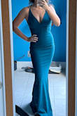 I needed a teal dress to wear as my maid of honor dress and this color was perfect. I wasn't sure if I should go with XS or S. S was out of stock so I went with XS and while it it tight, I think it's partly the style of the dress to be form-fitting. It's still wearable and I love that it gives me a nice shape. The fabric is thick and not slippery. I need to get it hemmed (that's a given since I'm short) and haven't worn it for the big day yet so I can't speak for how it is to wear it for hours, but I loved it trying it on and decided to keep it. - Marina V.