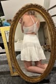Bought this as an option to wear to my elopement. Although I didn't end up wearing it, it was really flattering on and fit well. The lace in the back is stretchy and adds a bit of interest to an otherwise simple dress. The dress was longer than I expected, which I liked as well. A bit too simple for the look I was going for but a great dress nonetheless :) - Claire S.