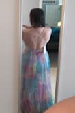 This dress is absolutely gorgeous in person. I am 5'5" 155lbs and got a Medium. I almost sized up to a large and I'm glad I didn't. It fits perfectly around the waist and flows beautifully to the floor. The top covers a good bit even with the low cut. I bought a low-cut backless/strapless bra to give my boobs a little push-up. My only complaint about this dress is the length. Again, I'm 5'5" and it is WAY too long, even with heels. I bought this dress to wear to a wedding this summer, and will also wear it on our beach vacation. I think it can be dressed up or down (flat sandals and a jean jacket). Overall, I would recommend this dress for sure - Stefanie C.
