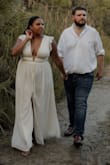 This dress was absolutely beautiful for my engagement photos. I have an "hourglass" figure but I'm a size 16/XL (45", 35", 47") but I have a high waist. The v neck plunge was very complementary to my shape and elongated my waist well. I also loved the weight and softness of the fabric. It's heavy in good way, and soft, but durable. It's also more ivory/light cream than white, but I liked it because it softened the look and worked well with my complexion. I would buy this again and in other colors if I could! The ONLY problem is that sometimes the front split would crease in an odd way, and I'd have to manually adjust the material by pulling the outer layer down and away from the lining to stop the weird fold. You can see it in the pictures, but it wasn't terrible to me. - Leslie H.