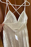This dress was one I was considering for my wedding. Customer service did their best to try to communicate to the manufacturer about a defect. The straps were sewn into the side hems of the dress, and not on either side of the zipper in back, as pictured. It made the straps dig in and be uncomfortable. 4 dresses were sent to me. After receiving the first defective one, it was indicated a quality check would occur to ensure the straps were sewn correctly. The 3 I received thereafter all had the same issue. Customer service was very understanding and issued me a refund, in the end. Such a disappointment though, especially since it wasted a lot of valuable time having to ship and return the first few defective dresses. - Kimmy O.