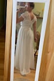 I originally ordered a Small and exchanged it with ease for a Medium. The Medium fits great. I will need it hemmed a bit and the top taken in around the bottom part because it feels a bit loose. But this is just all for comfort. The dress is great quality and I cannot wait to wear it on my wedding day. - Shannon F.