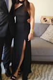 Fits true to size, very comfortable and cute black dress. Was not super long, was able to wear with heels without having to shorten the dress - Ester M.