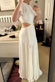 This is flowy and sexy and beautiful. I plan on wearing it for my wedding rehearsal and on my honeymoon. I bought a medium and it was a little loose (I wouldn't have sized down) and it was way too long. Even with heals it was too long for me (I'm 5'7) and I'm having it hemmed - Chelsea S.