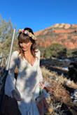 I got married in it on a super cold day in Sedona so I added warm tights and cowboy boots to it. Popped a flower crown on from Etsy and it looked like a million bucks. The quality is stunning and the length is perfection for tall girls like myself. Fits like a glove. Buy some breast tape on Amazon to get your cleavage to sit right. But this dress is gorgeous. - Dana B.