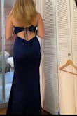 This dress was very pretty, the color and sparkles. The back is cute too. It's not as flattering as others since there is no slit and it's not a kind of material that will suck you in. But still pretty. - Eva M.