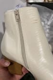 I'm a 7.5 and the 7.5 fit great, seemed comfortable in the 30 seconds I had it on. However, the shoe arrived with brown marks on the body and the heel looked like it was ungluing. Had to return. - Monica L.
