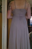 Lovely color. Noticeably heavy with the very thin spaghetti straps. The bust was loose and would require me to get it sized. It's also very long. I'm 5'4" and had a 3" heel and it was still dragging on the ground by about 3 inches - Gail S.