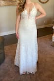 I chose to order a wedding dress online to save on the cost of it and was so pleasantly surprised! The details with the pearls and flowers are gorgeous. This dress made me feel so beautiful and I'm incredibly happy with it! It was a little tight to get over my butt but fits perfectly. My favorite part of the dress is the top part with the low dip. It is the perfect amount of sexy. Another plus is that a bra is not needed, it comes with a good amount of padding. The back is complicated to do so make sure to have someone help you! I highly recommend saving your money and ordering from Lulus! - Hallie E.