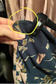 Pretty dress to wear as a guest to a spring wedding. Very comfortable. The only problem, and the reason I'm giving 3 stars, is the boning popped through on both sides under my arms, after 2 hours. I kept having to push it back in. Very annoying and I can't even wear the dress a second time.  I didn't really have trouble with the top falling down. I'm a 32 DD and it fits just right. I wore a stick-on bra and I think that helped it stay up. - Danielle F.