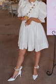 As a bride, I found myself buying many pairs of white shoes and then trying to build my outfits around them. I bought a dress and had absolutely no shoes to wear with them and didn't want to break the bank on yet another pair of white shoes. I searched high and low for the perfect pumps with a little white bow and these were absolutely perfect!! They are a more matte paten leather look rather than shiny, which is what I was looking for! Comfortability was about an 7/10 as they do not have cushion and the heel is pretty small, but I wouldn't consider that even a complaint. I just really enjoyed the shoe!! - Maddie C.